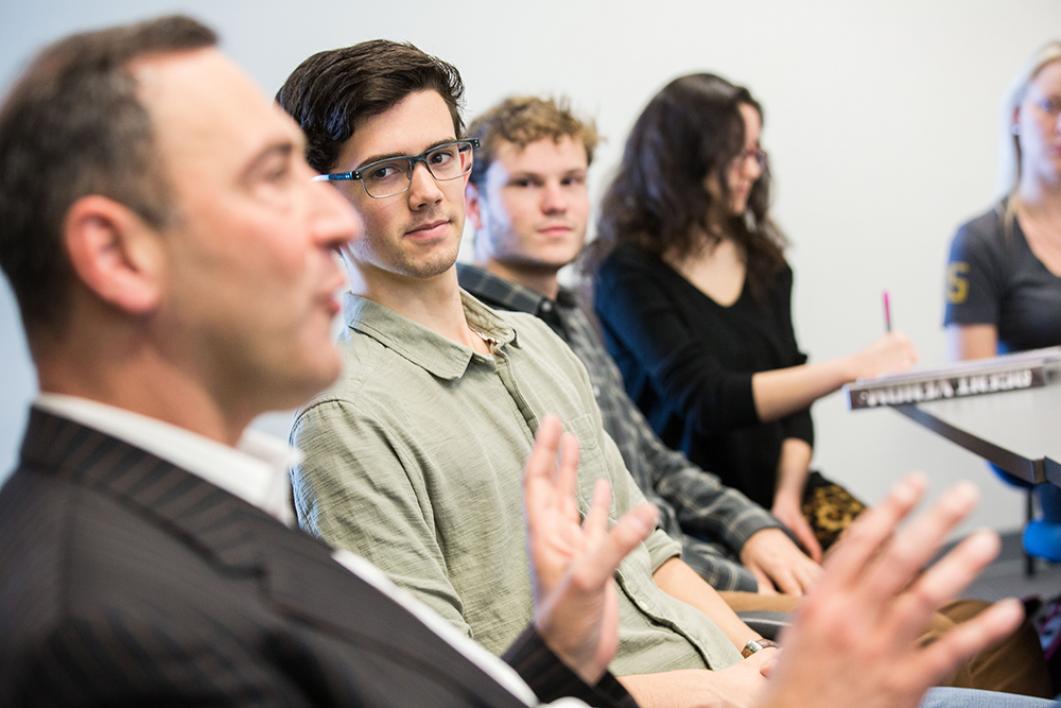 Student looking at teacher while teacher explains something